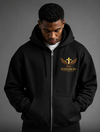 Black zip-up hoodie with 'Elevate Up' logo on front and back, worn by a person against a gray background.